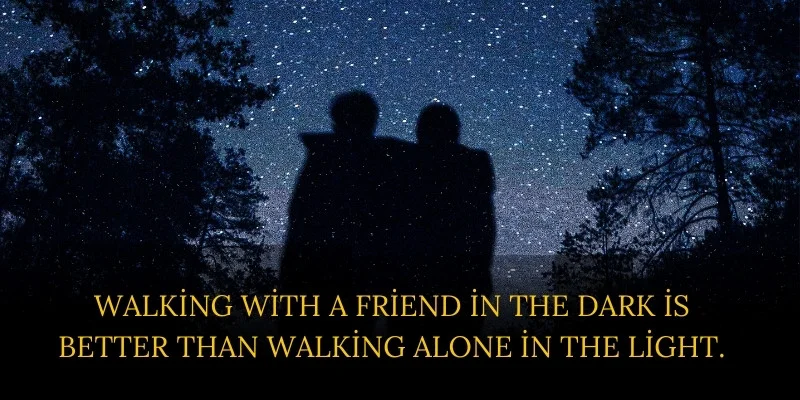 Two friends walking in the dark under a night sky. Which is best than walking alone.