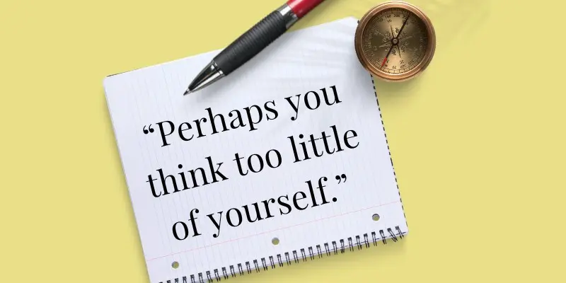 Perhaps you think too little of yourself quote on a notebook with a pen and compass