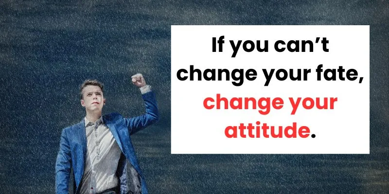 A young man in a suit raising his hand firmly in the air while it rains, next to an encouraging quote about changing one's attitude.
