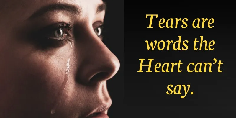 Tears streaming down a person's face, symbolizing unspoken emotions and inner pain.