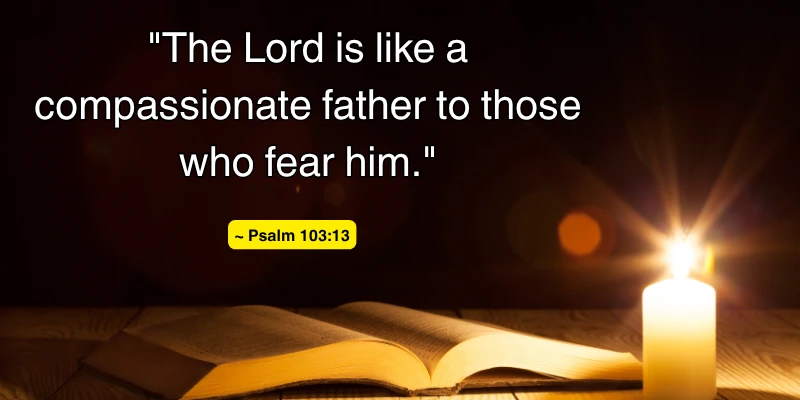 A candlelit Bible with a quote from Psalm 103:13 about the compassionate nature of God as a father