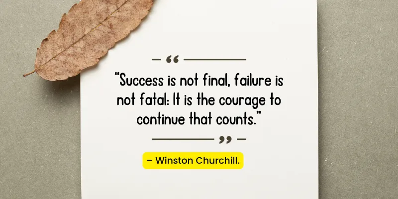 Motivational quote by Winston Churchill on a piece of paper, with the message: 'Success is not final, failure is not fatal.